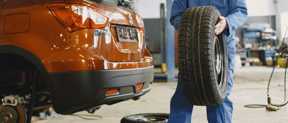 Tire being held by a person for repair